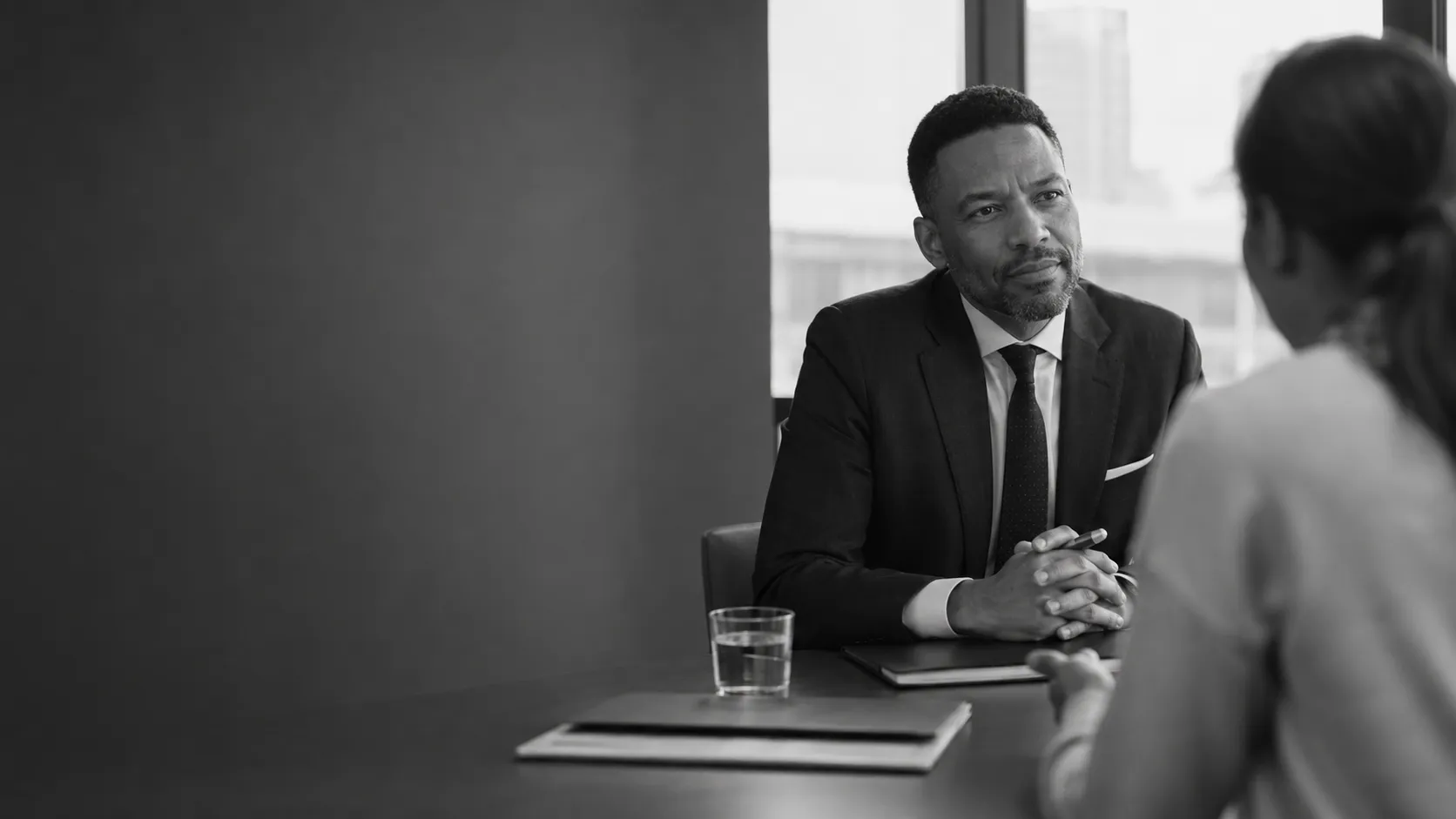 Attorney reviewing civil claim documents with a client